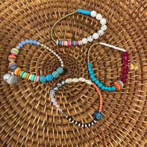 Arm candy!!😍 fun set of 4 beaded stretch bracelets.